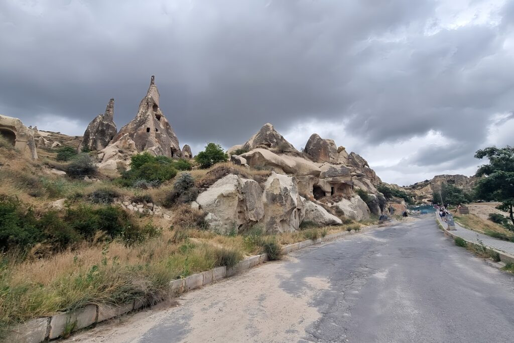 a road with a bunch of rocks on the side of it
